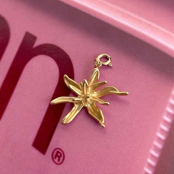 Golden flower charm